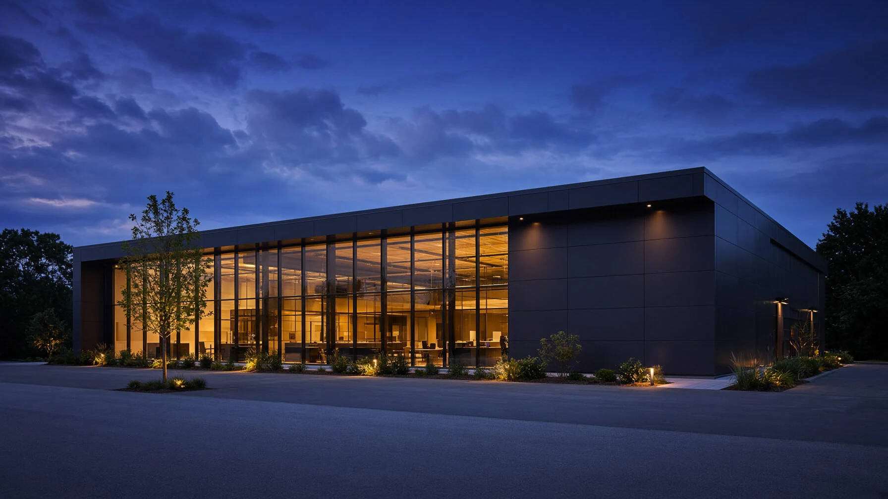 Commercial architecture illuminated at dusk.